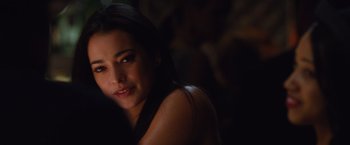 Movie still from “Broken City” (2013), directed by Allen Hughes – A beautiful young lady posing for a picture; Close Up shot, Over the shoulder angle