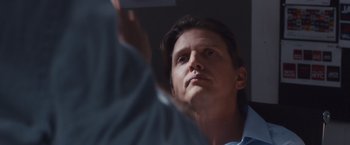 Movie still from “Broken City” (2013), directed by Allen Hughes – A person looking up at something; Close Up shot, Low angle