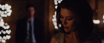 Movie still from “Broken City” (2013), directed by Allen Hughes – A person wearing a dress; Close Up shot, Over the shoulder angle