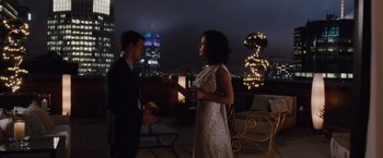 Movie still from “Broken City” (2013), directed by Allen Hughes – A man and a woman standing next to each other; Wide shot, High angle