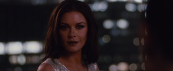 Movie still from “Broken City” (2013), directed by Allen Hughes – A person wearing a white dress; Close Up shot, Over the shoulder angle