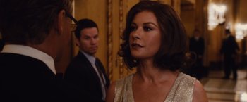 Movie still from “Broken City” (2013), directed by Allen Hughes – A man and a woman standing next to each other in a room; Close Up shot, Over the shoulder angle
