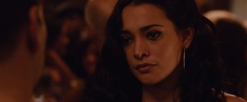 Movie still from “Broken City” (2013), directed by Allen Hughes – A person with long dark hair; Close Up shot, Over the shoulder angle