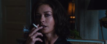 Movie still from “Broken City” (2013), directed by Allen Hughes – A person smoking a cigarette; Close Up shot, Over the shoulder angle