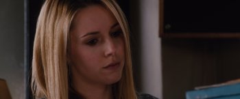 Movie still from “Broken City” (2013), directed by Allen Hughes – A person with long blonde hair; Close Up shot, Over the shoulder angle