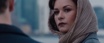 Movie still from “Broken City” (2013), directed by Allen Hughes – A person wearing a scarf; Close Up shot, Over the shoulder angle