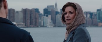 Movie still from “Broken City” (2013), directed by Allen Hughes – A woman standing in front of a body of water; Close Up shot, Over the shoulder angle