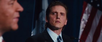 Movie still from “Broken City” (2013), directed by Allen Hughes – A person wearing a suit and tie; Close Up shot, Low angle