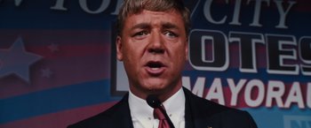 Movie still from “Broken City” (2013), directed by Allen Hughes – A person wearing a suit and tie; Close Up shot, Low angle