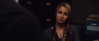 Movie still from “Broken City” (2013), directed by Allen Hughes – A beautiful blonde woman wearing a red and black scarf; Close Up shot, Over the shoulder angle