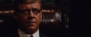 Movie still from “Broken City” (2013), directed by Allen Hughes – A person wearing a suit and tie; Close Up shot, Low angle