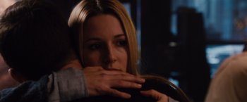 Movie still from “Broken City” (2013), directed by Allen Hughes – A person covering a face with their hands; Close Up shot, Over the shoulder angle