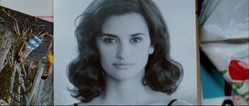 Movie still from “Broken Embraces” (2009), directed by Pedro Almodóvar – A black and white photo of a woman's face; Close Up shot, Low angle
