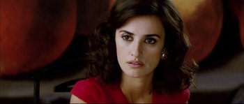 Movie still from “Broken Embraces” (2009), directed by Pedro Almodóvar – A person wearing a red shirt; Close Up shot, Over the shoulder angle