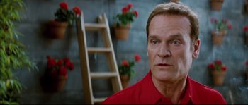 Movie still from “Broken Embraces” (2009), directed by Pedro Almodóvar – A person wearing a red shirt; Close Up shot, Low angle