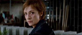 Movie still from “Broken Embraces” (2009), directed by Pedro Almodóvar – A person wearing a jean jacket; Close Up shot, Low angle