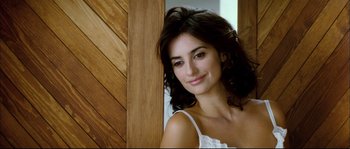 Movie still from “Broken Embraces” (2009), directed by Pedro Almodóvar – A beautiful young lady posing for a picture; Close Up shot, Low angle