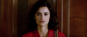 Movie still from “Broken Embraces” (2009), directed by Pedro Almodóvar – A person wearing a red shirt; Close Up shot, Low angle