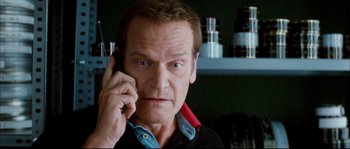 Movie still from “Broken Embraces” (2009), directed by Pedro Almodóvar – A person talking on a cell phone; Close Up shot, Low angle