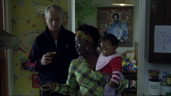 Movie still from “Broken Flowers” (2005), directed by Jim Jarmusch – A man and a woman holding a baby in their arms; Medium shot, Over the shoulder angle