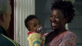 Movie still from “Broken Flowers” (2005), directed by Jim Jarmusch – A woman holding a baby with a pacifier in her mouth; Close Up shot, High angle