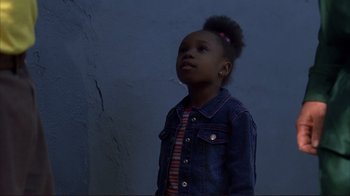 Movie still from “Broken Flowers” (2005), directed by Jim Jarmusch – A little girl standing in front of a blue wall; Close Up shot, Low angle