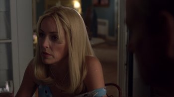 Movie still from “Broken Flowers” (2005), directed by Jim Jarmusch – A woman sitting at a table in front of a mirror; Close Up shot, Over the shoulder angle