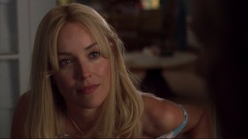 Movie still from “Broken Flowers” (2005), directed by Jim Jarmusch – A person with blond hair; Close Up shot, Over the shoulder angle