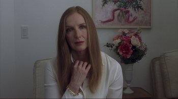Movie still from “Broken Flowers” (2005), directed by Jim Jarmusch – A woman sitting in front of a flower arrangement; Close Up shot, Over the shoulder angle