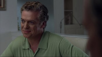 Movie still from “Broken Flowers” (2005), directed by Jim Jarmusch – A person sitting on a couch; Close Up shot, Over the shoulder angle