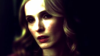 Movie still from “Broken Flowers” (2005), directed by Jim Jarmusch – A woman's face in a dimly lit room; Extreme Close Up shot, Low angle