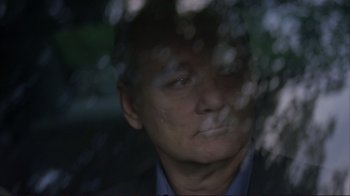 Movie still from “Broken Flowers” (2005), directed by Jim Jarmusch – A person looking out of a window; Close Up shot, Over the shoulder angle