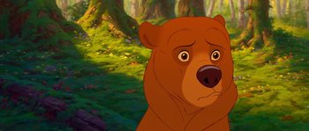 Movie still from “Brother Bear” (2003), directed by Robert Walker – A brown bear is standing in the forest; Close Up shot, Low angle