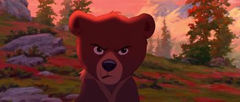 Movie still from “Brother Bear” (2003), directed by Robert Walker – A cartoon of a brown bear with an angry look on his face; Close Up shot, Low angle