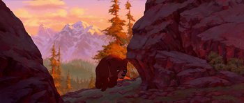 Movie still from “Brother Bear” (2003), directed by Robert Walker – A painting of a brown bear in the wilderness; Wide shot, Low angle
