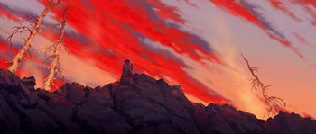 Movie still from “Brother Bear” (2003), directed by Robert Walker – A man sitting on top of a rock on top of a mountain; Extreme Wide shot, Low angle