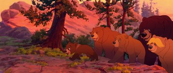 Movie still from “Brother Bear” (2003), directed by Robert Walker – Two bears and a bear cub in a forest; Wide shot, Low angle