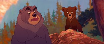 Movie still from “Brother Bear” (2003), directed by Robert Walker – Two animated bears are standing next to each other on a hill; Medium shot, Over the shoulder angle