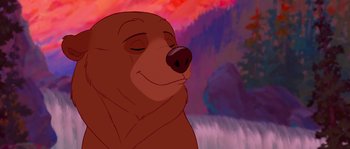 Movie still from “Brother Bear” (2003), directed by Robert Walker – A brown bear is looking up at a waterfall; Close Up shot, Low angle