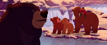 Movie still from “Brother Bear” (2003), directed by Robert Walker – A group of brown bears standing on top of a snow covered slope; Wide shot, Low angle