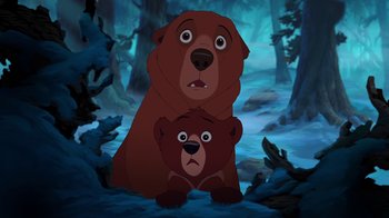 Movie still from “Brother Bear 2” (2006), directed by Ben Gluck – A bear and a bear cub in a forest; Medium shot, Low angle