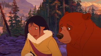 Movie still from “Brother Bear 2” (2006), directed by Ben Gluck – A woman and a brown bear in a forest; Medium shot, Over the shoulder angle