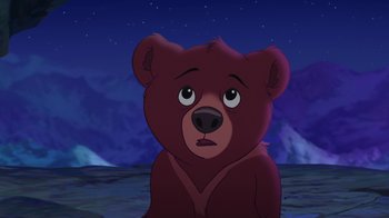 Movie still from “Brother Bear 2” (2006), directed by Ben Gluck – A brown teddy bear sitting on top of a hill; Close Up shot, High angle