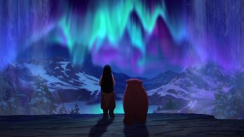 Movie still from “Brother Bear 2” (2006), directed by Ben Gluck – An animated scene of a woman and a bear in front of the aurora borealis; Extreme Wide shot, Over the shoulder angle