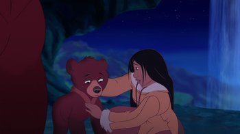 Movie still from “Brother Bear 2” (2006), directed by Ben Gluck – An animated scene of a woman petting a bear; Medium shot, Low angle