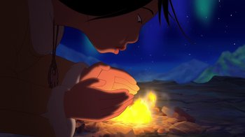 Movie still from “Brother Bear 2” (2006), directed by Ben Gluck – A person holding their hands over a fire; Close Up shot, Over the shoulder angle