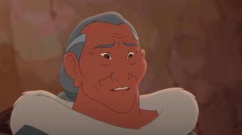 Movie still from “Brother Bear 2” (2006), directed by Ben Gluck – An old man with long grey hair is smiling; Close Up shot, Over the shoulder angle