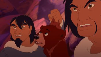 Movie still from “Brother Bear 2” (2006), directed by Ben Gluck – A group of people standing next to each other with a bear; Close Up shot, Over the shoulder angle