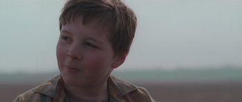 Movie still from “Bullhead” (2011), directed by Michaël R. Roskam – A young boy's face; Close Up shot, Low angle