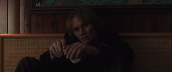 Movie still from “Bullhead” (2011), directed by Michaël R. Roskam – A man holding a wii remote in his hands; Close Up shot, Low angle